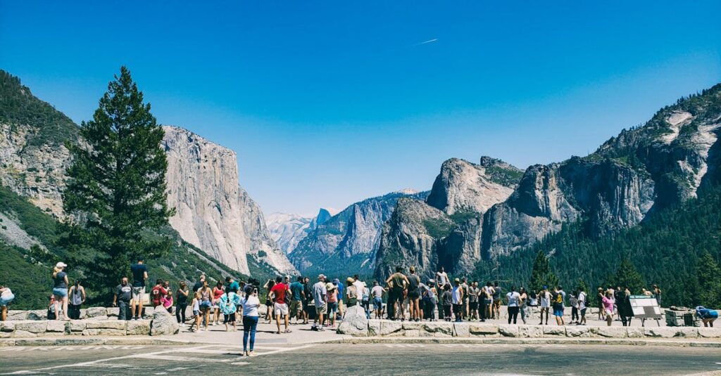8 Incredible Reasons For Hiring Black Service Limos 3 Crowds marvel at the iconic rock formations under a clear blue sky in Yosemite National Park.