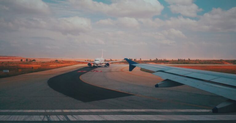 A runway scene with airplanes against a dramatic sunset sky, capturing aviation's essence.