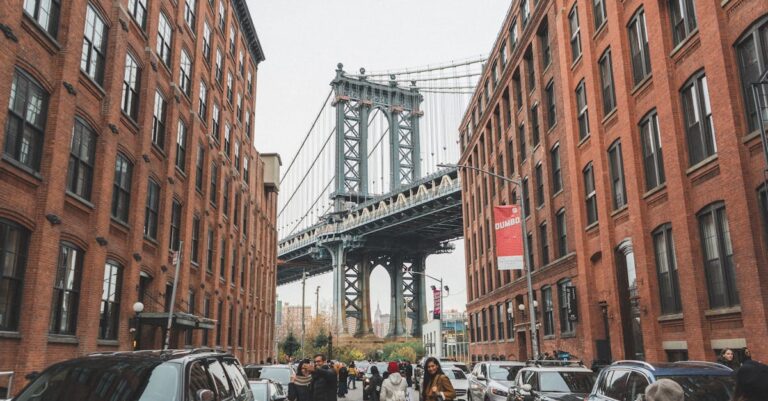 Scenic view of the Manhattan Bridge framed by urban architecture in DUMBO, Brooklyn, NYC.