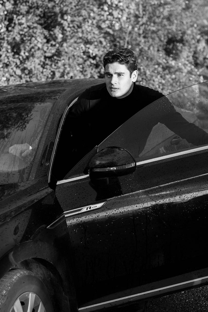Man stepping out of a black car