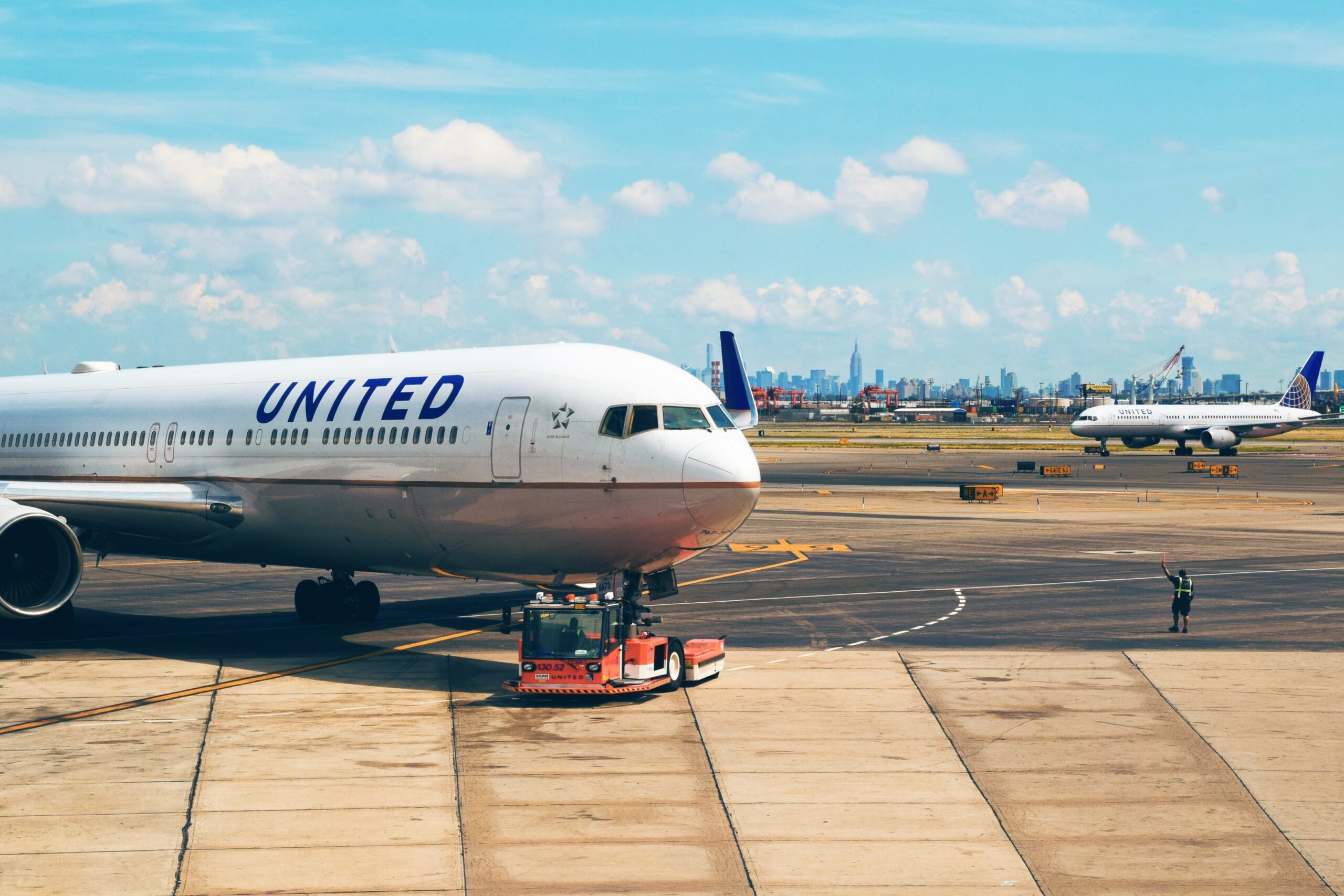 manhattan to newark airport car service — Newark Liberty Terminal A exterior at dusk.