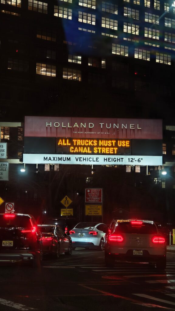 Holland Tunnel entrance at night — car service NYC to Newark route