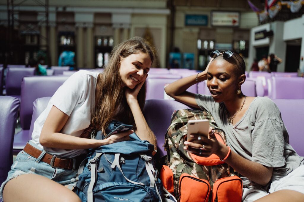 Travelers relaxing in the airport lounge while they wait for their ride to New York City